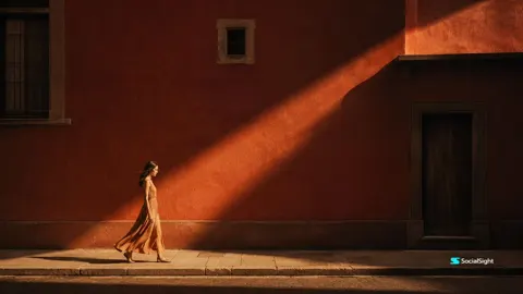 Cinematic urban golden hour woman red wall