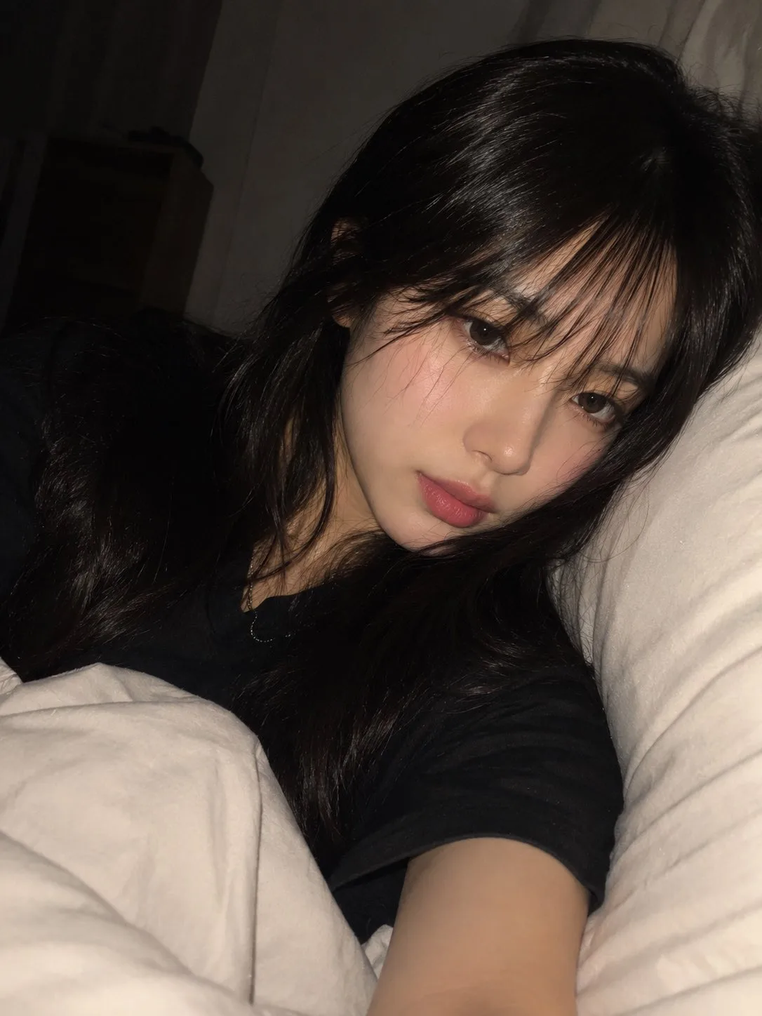 Realistic east asian woman nighttime bedroom selfie — After