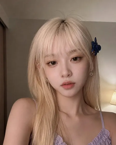 Young woman bedroom selfie blonde lavender top