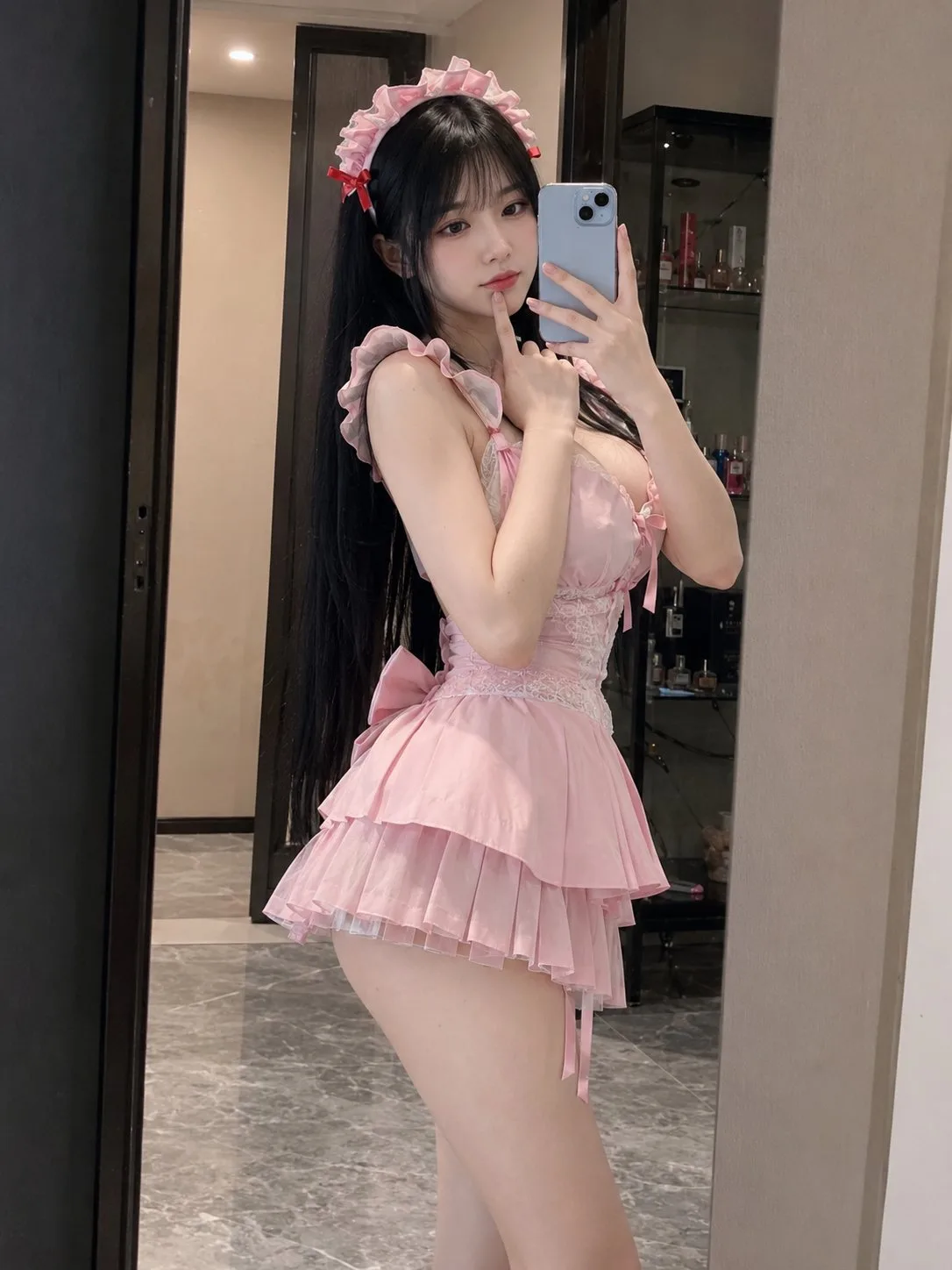 East asian woman maid outfit mirror selfie — After