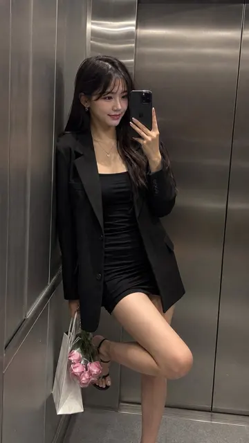 Modern brushed steel elevator mirror selfie