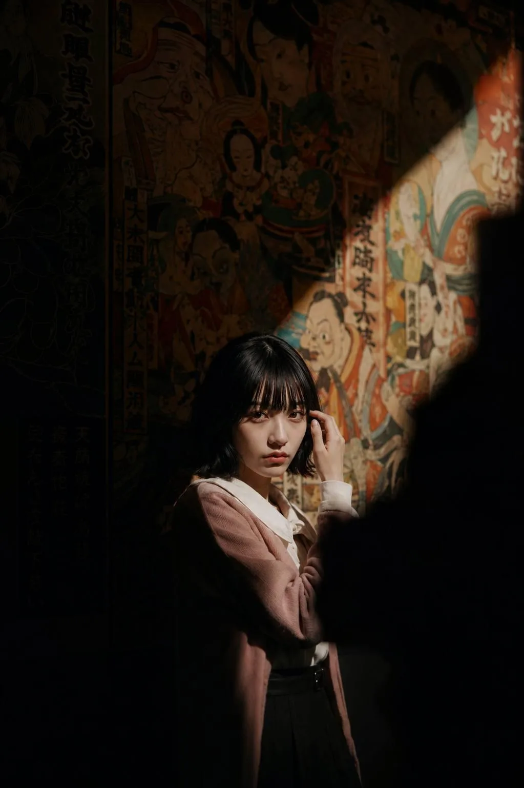 Cinematic portrait woman dark exhibition room spotlight — After