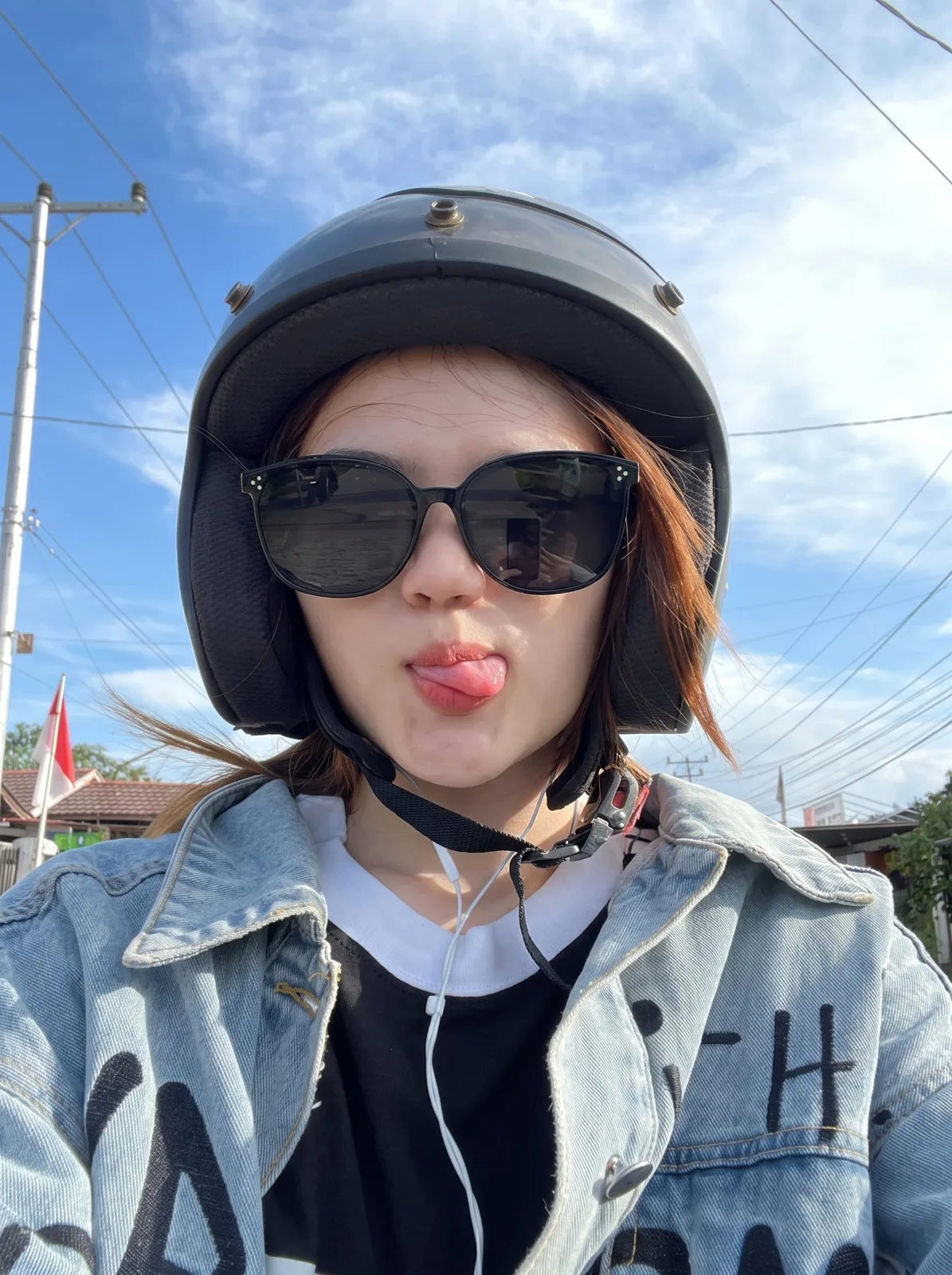 Playful selfie auburn hair motorcycle helmet — Sonra