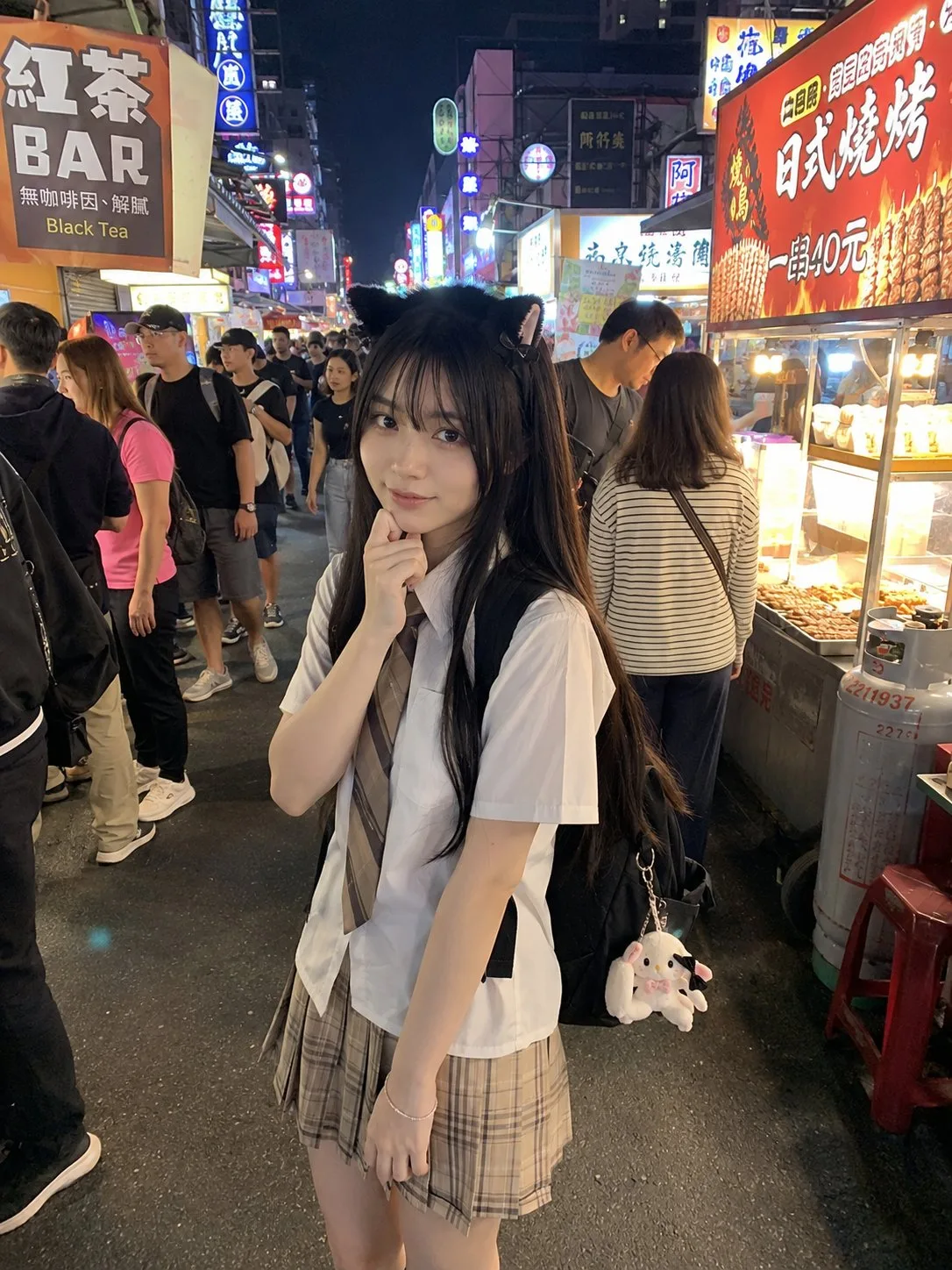 Japanese girl cat ear headband night market street photo — After