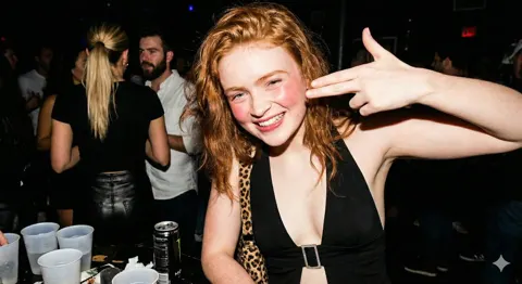 Redhead party finger gun