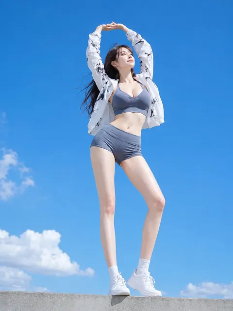 White sleeves stretching towards blue sky woman
