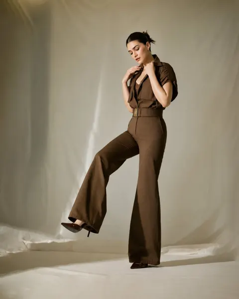 Elegant woman coffee brown jumpsuit editorial