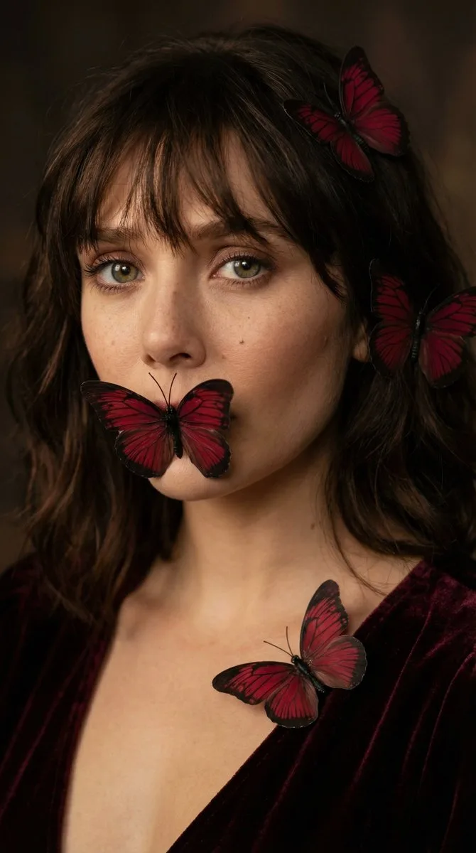 Mysterious girl with butterfly covering mouth — After