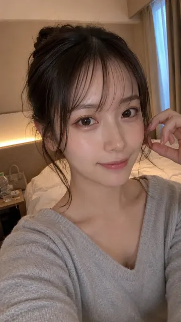 Japanese woman hotel bedside close up selfie