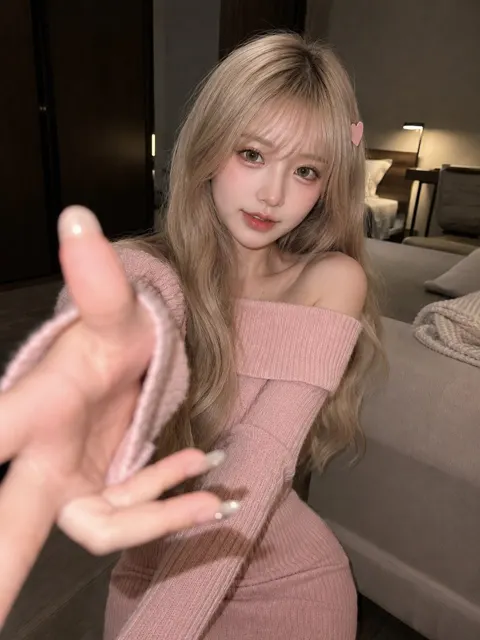 Indoor pink knit blonde woman iphone candid photography
