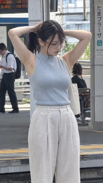 Japanese station platform woman tying hair iphone snapshot