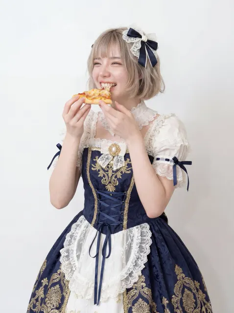 Eating pizza fashion studio portrait