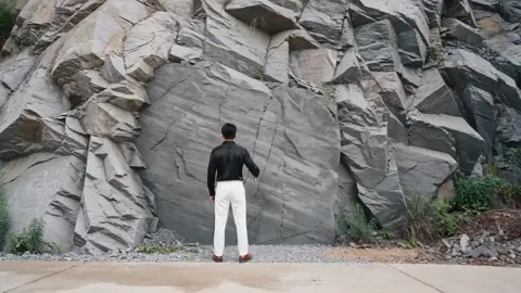 Chiseling mountain into dream bar