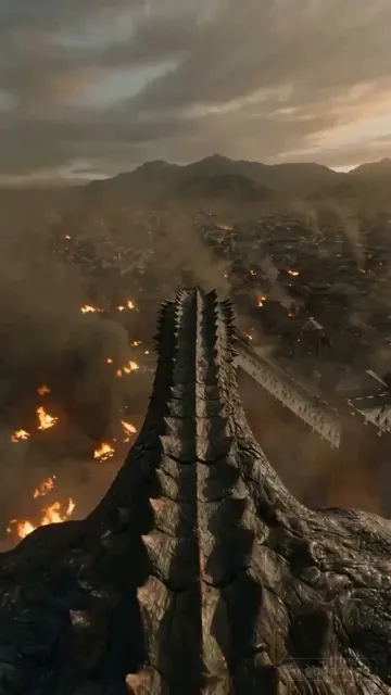 First person dragon flight over burning city