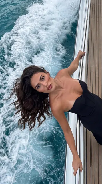 Luxury yacht top down woman black dress