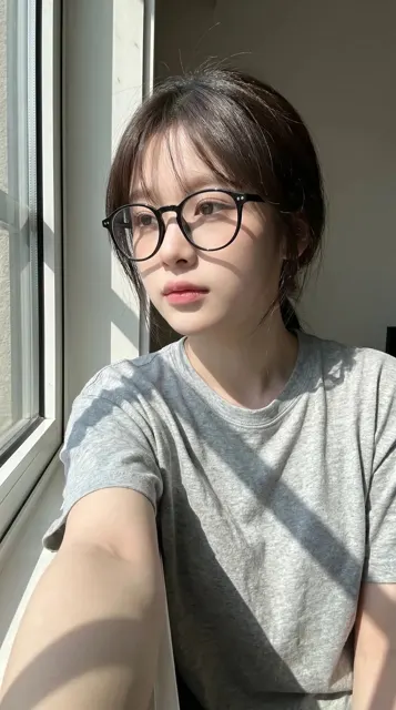 Realistic smartphone selfie portrait east asian woman window light