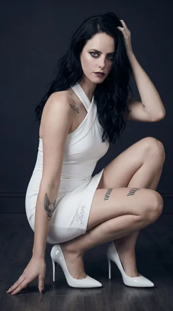 Stunning woman white halter dress studio portrait