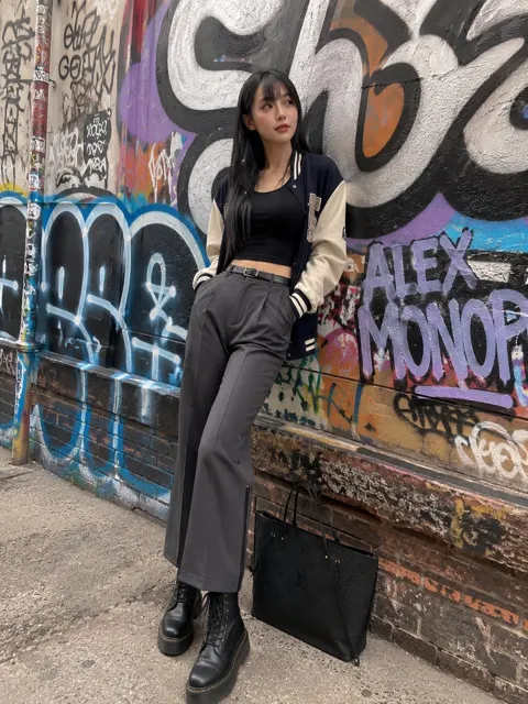 Stylish east asian woman urban graffiti iphone snapshot