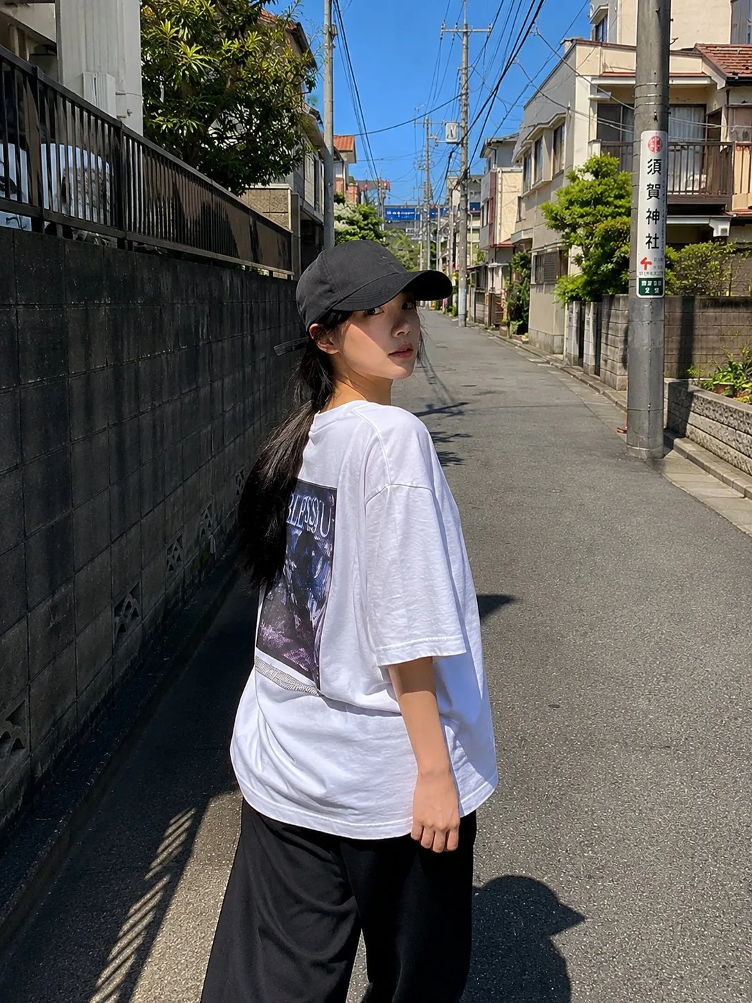 Beautiful japanese woman red varsity jacket street photography — After