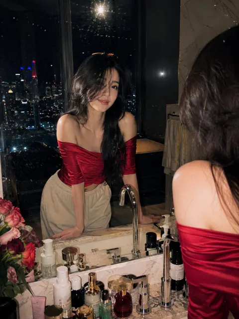 Luxury penthouse bathroom night portrait woman red satin