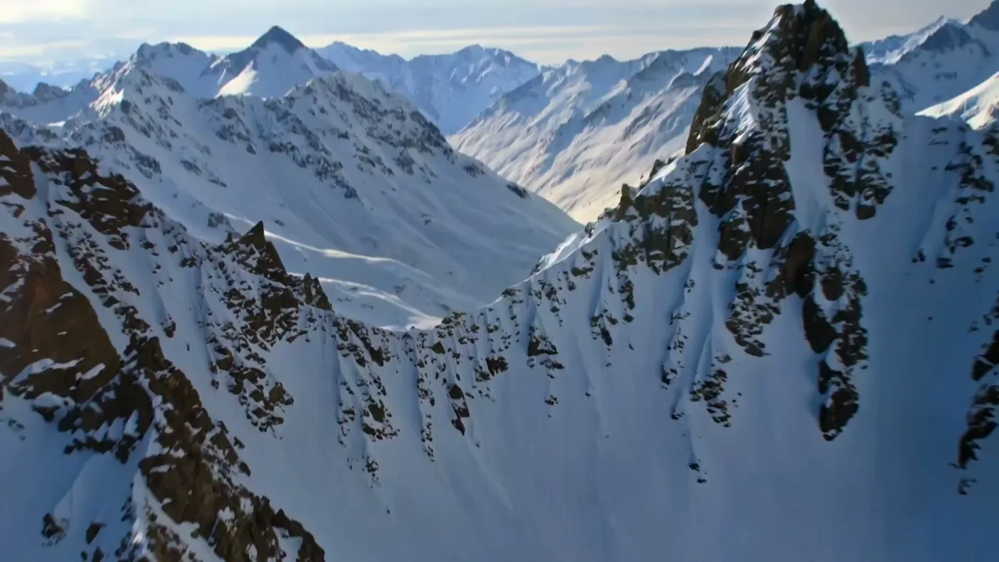 Avalanche chasing train aerial shot — After