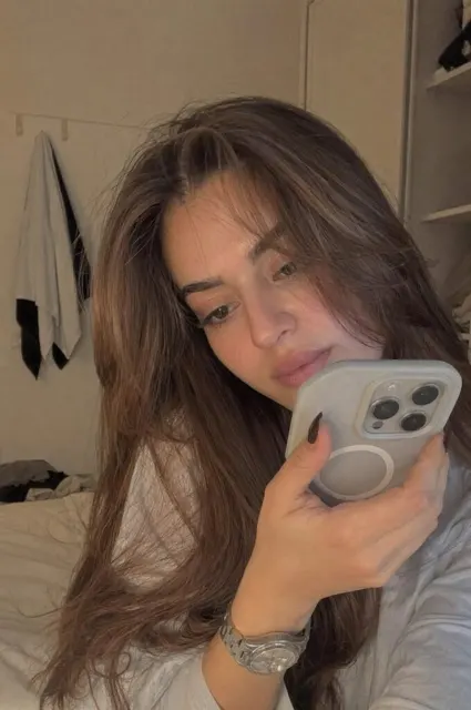 Shy girl recording video