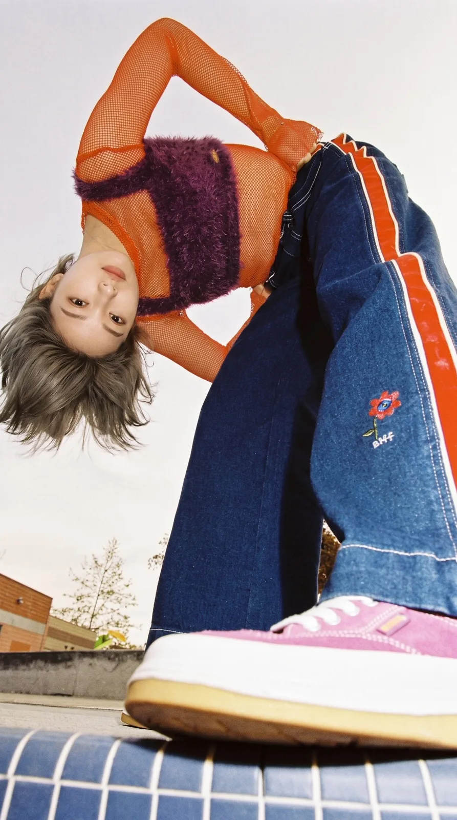 90s fashion editorial extreme low angle woman portrait — After