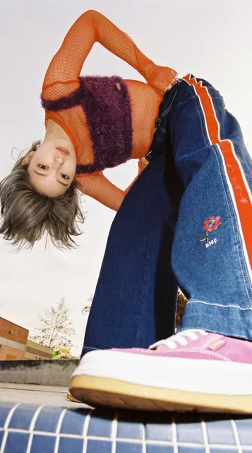 90s fashion editorial extreme low angle woman portrait