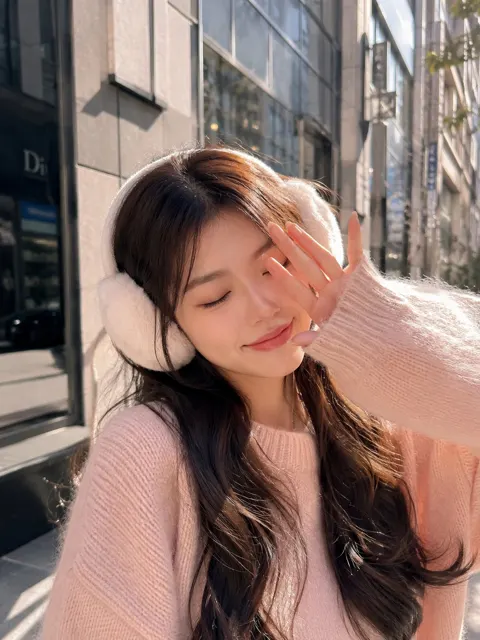 Cozy winter street portrait pink sweater girl
