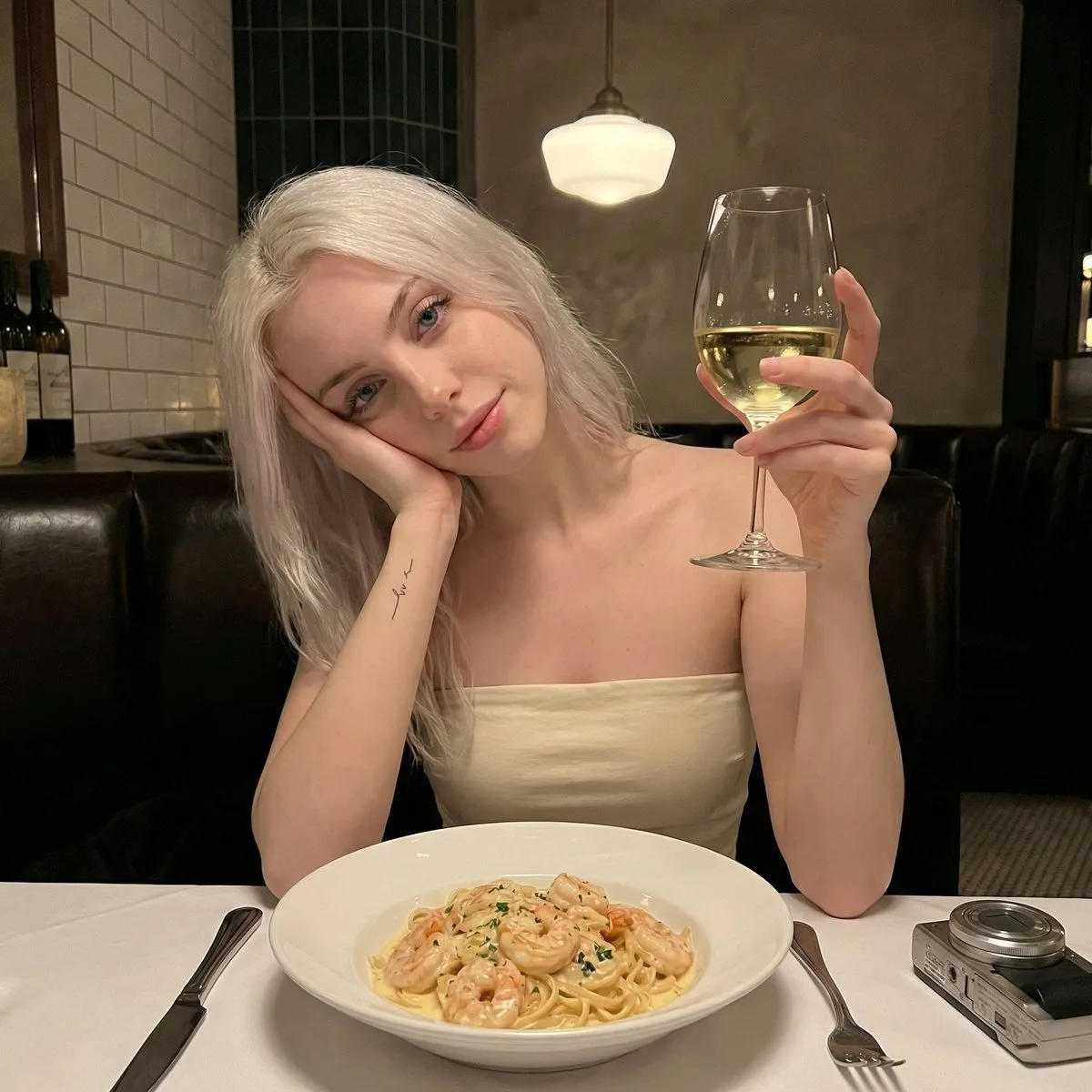 Dim light dinner blonde selfie — After