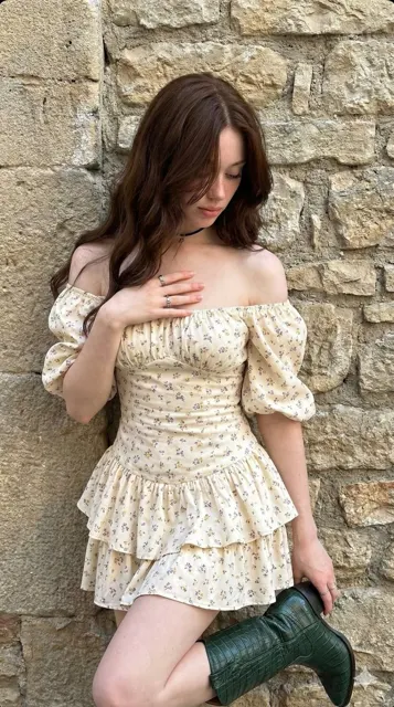 Floral dress girl holding green boot
