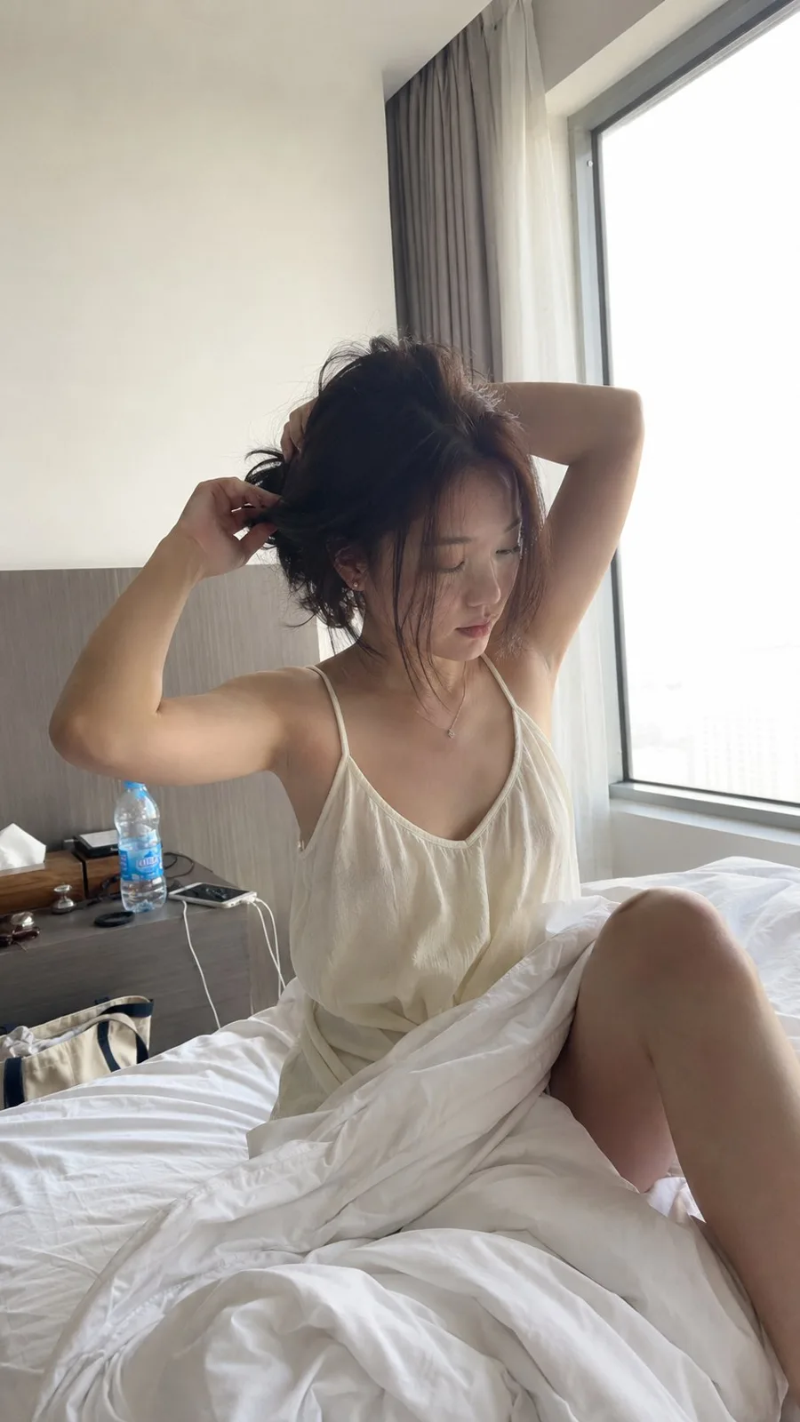 Morning hotel room hair fixing lifestyle snapshot — After