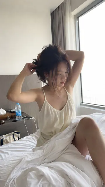 Morning hotel room hair fixing lifestyle snapshot