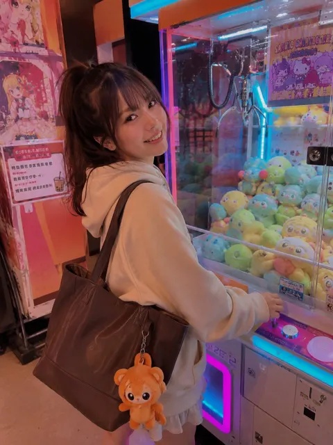 Vibrant arcade claw machine young woman