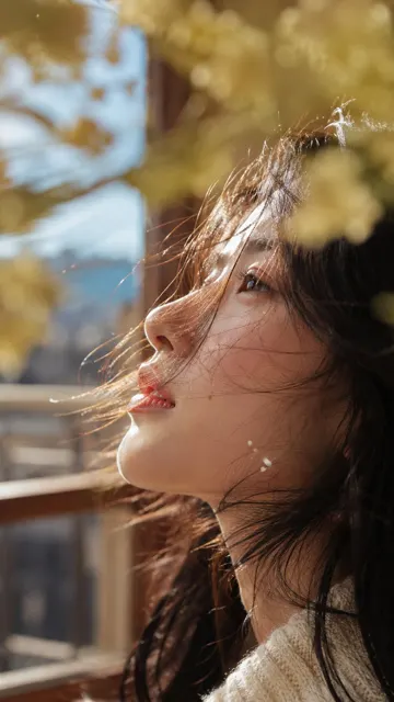 Young east asian woman side profile sunlight portrait