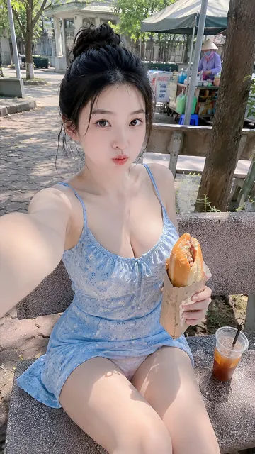Girl in light blue patterned dress campus selfie