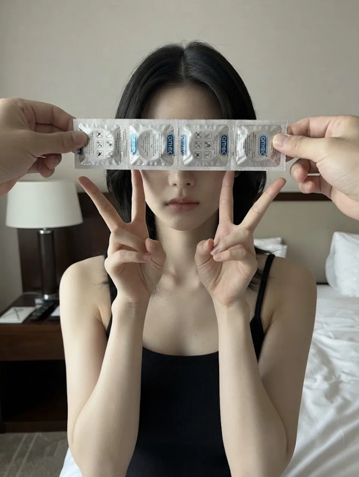Hotel room girl double v gesture condom wrapper — Sonra