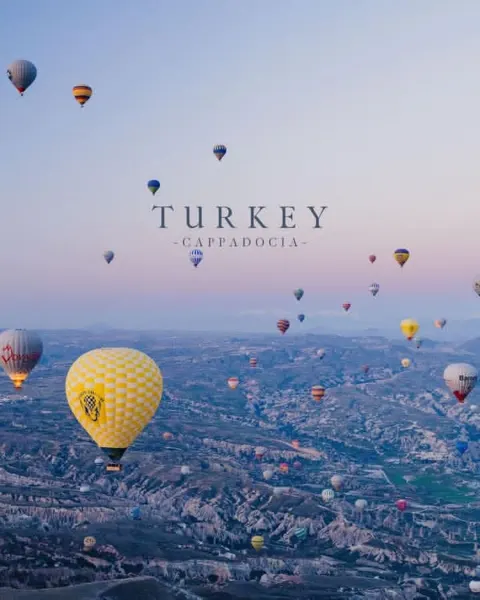 Cinematic travel poster hot air balloons sunrise