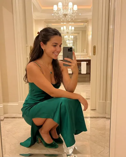 Luxury hotel emerald dress selfie