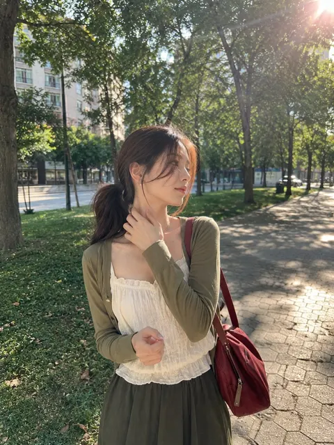 Sunny afternoon urban park woman portrait
