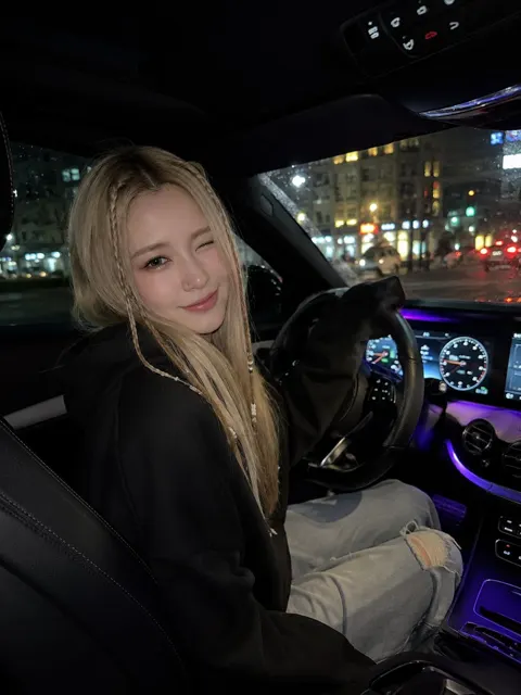 Night car selfie blonde woman luxury interior