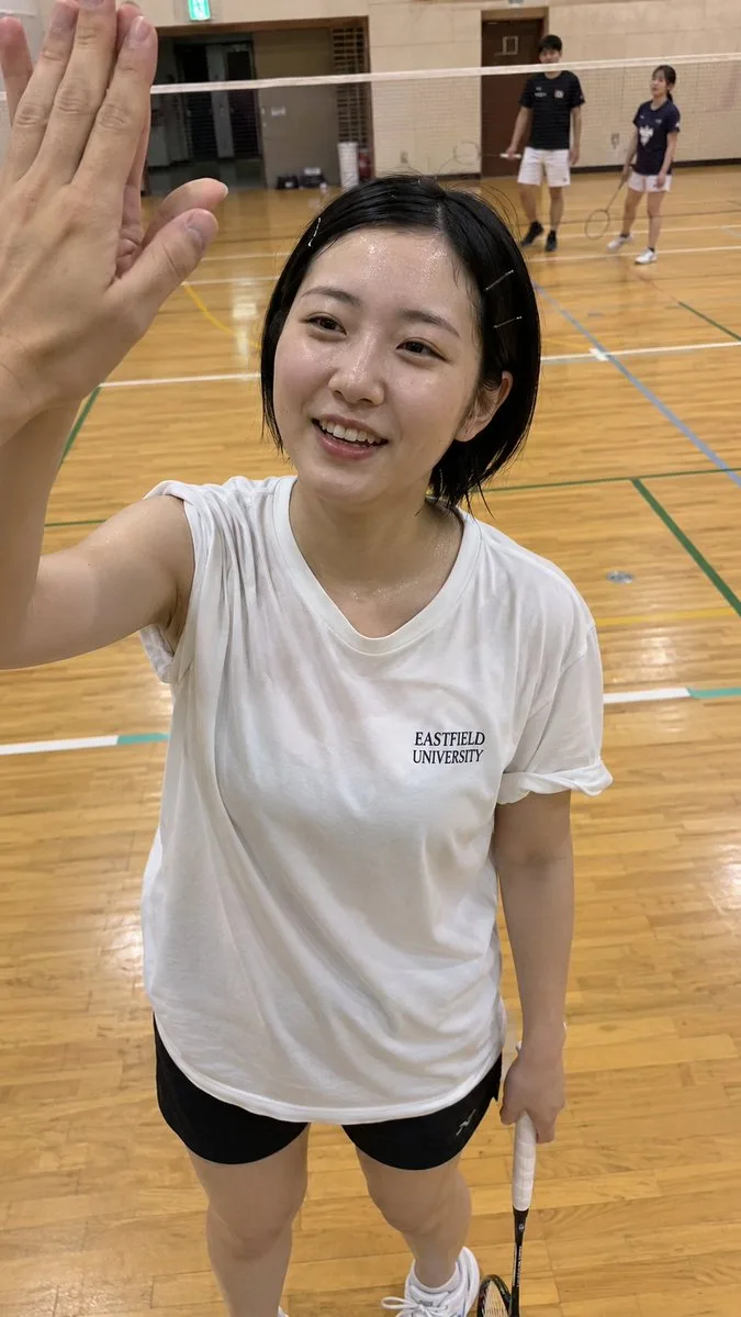 University badminton mixed doubles high five pov snapshot — Sonra