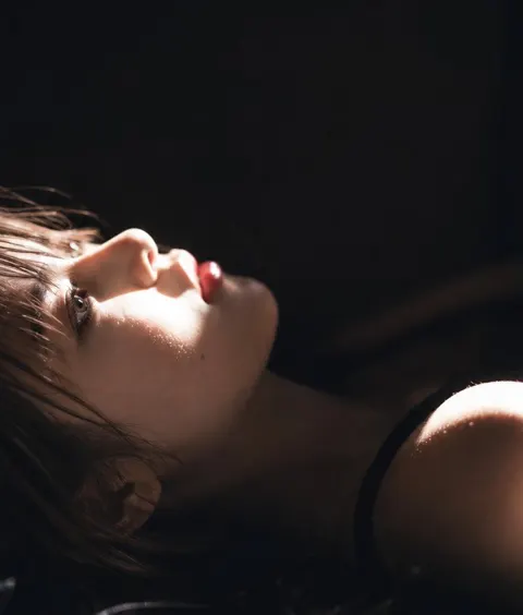 Photorealistic east asian woman dark cinematic portrait