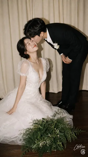 Vintage film wedding snapshot groom kissing kneeling bride