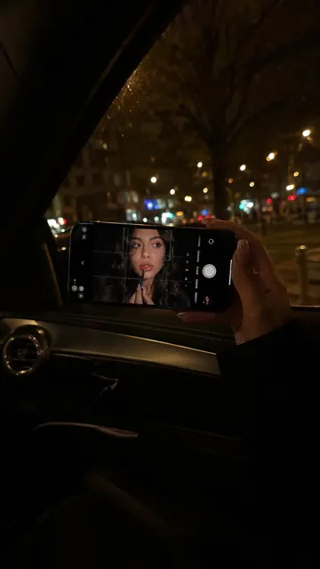 The photo is taken inside a car